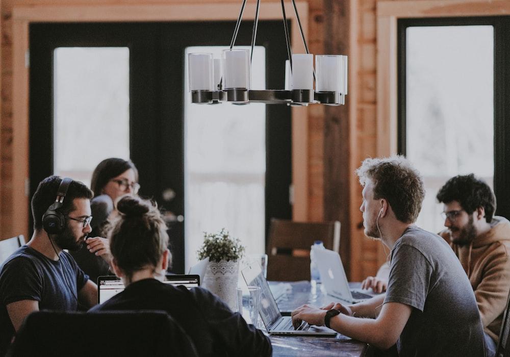 Our team collaborating around a table on a client project